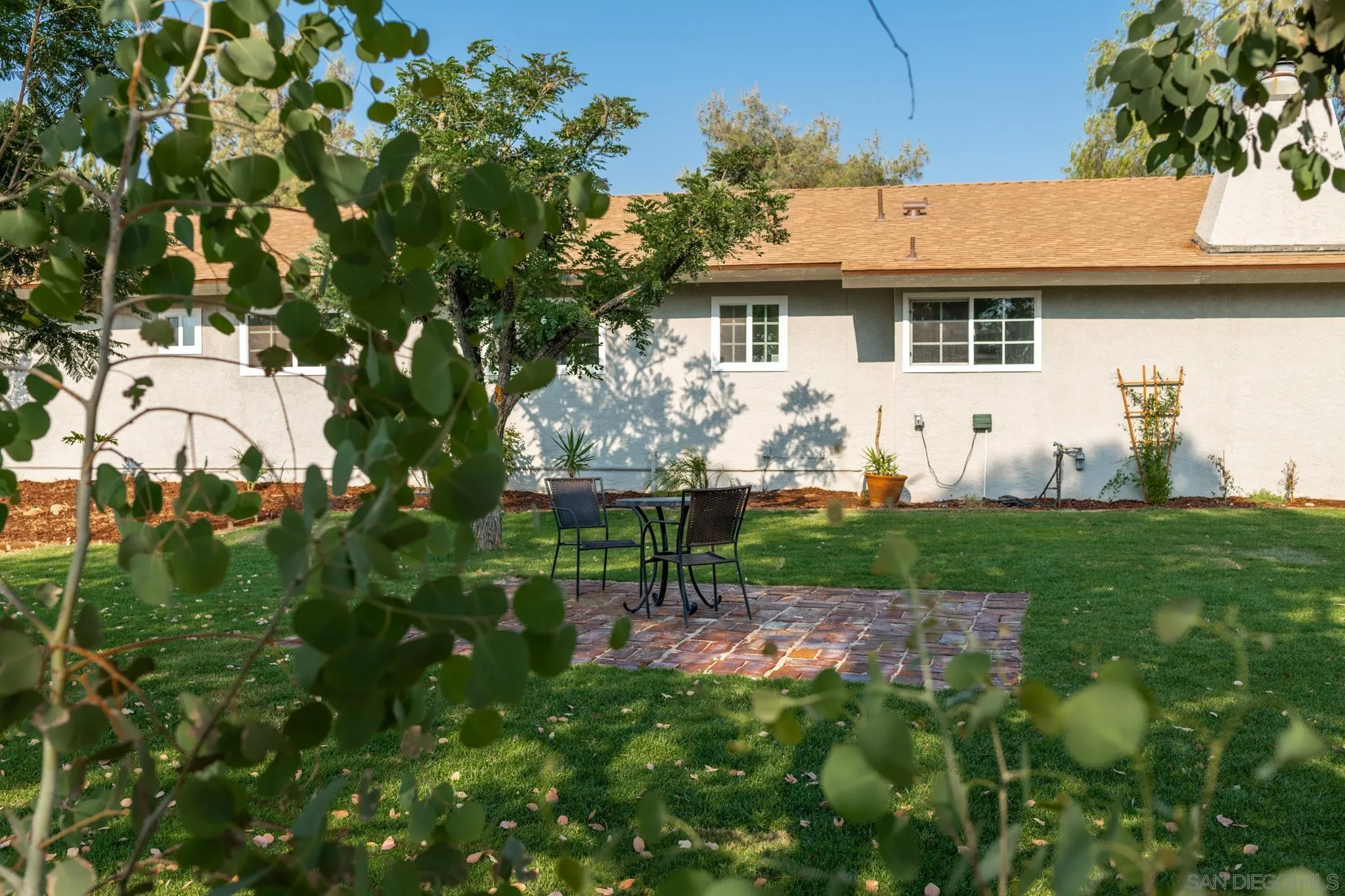 25511 Potrero Valley Road Potrero, CA 91963 - Photo 4 of 48 a view of a white house with a yard and plants