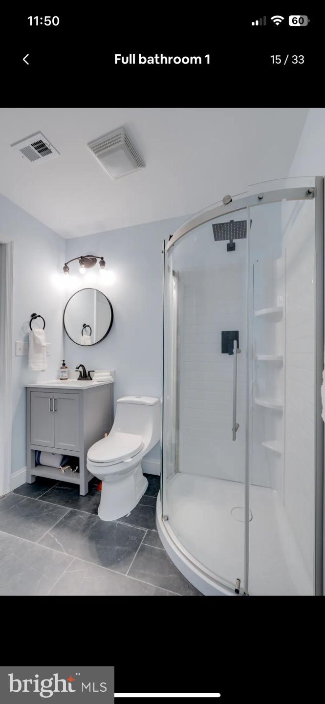 23794-23790 St Clair Road California, MD 20619 - Photo 18 of 20 a bathroom with a sink and a mirror