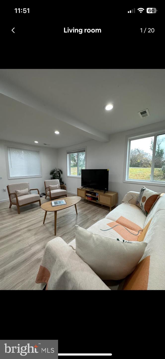 23794-23790 St Clair Road California, MD 20619 - Photo 19 of 20 a living room with furniture and a flat screen tv
