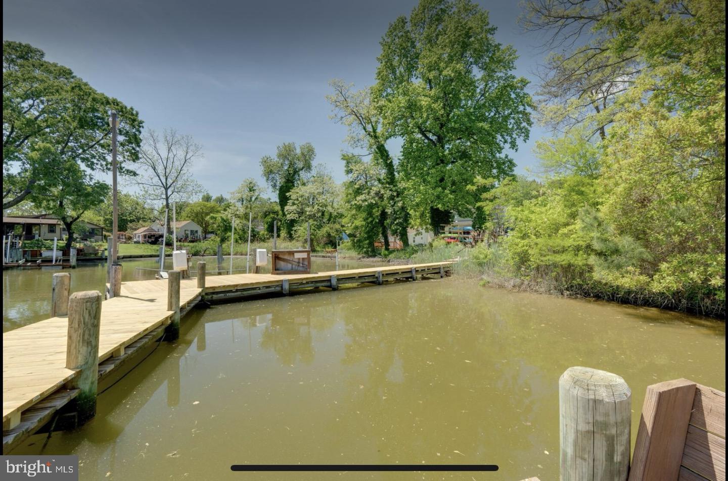23794-23790 St Clair Road California, MD 20619 - Photo 9 of 20 a view of a swimming pool with a lake view