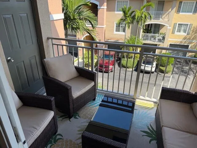 a view of balcony with outdoor seating