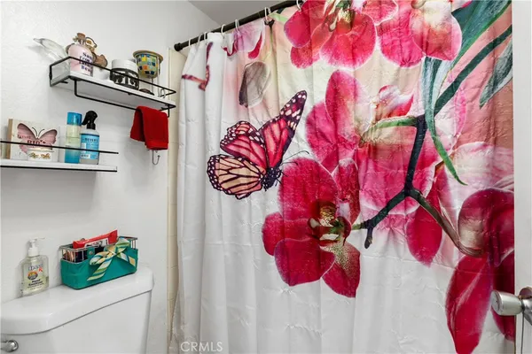 a bathroom with a bathtub and a white sink