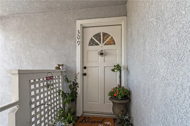a vase of flowers sitting on a floor