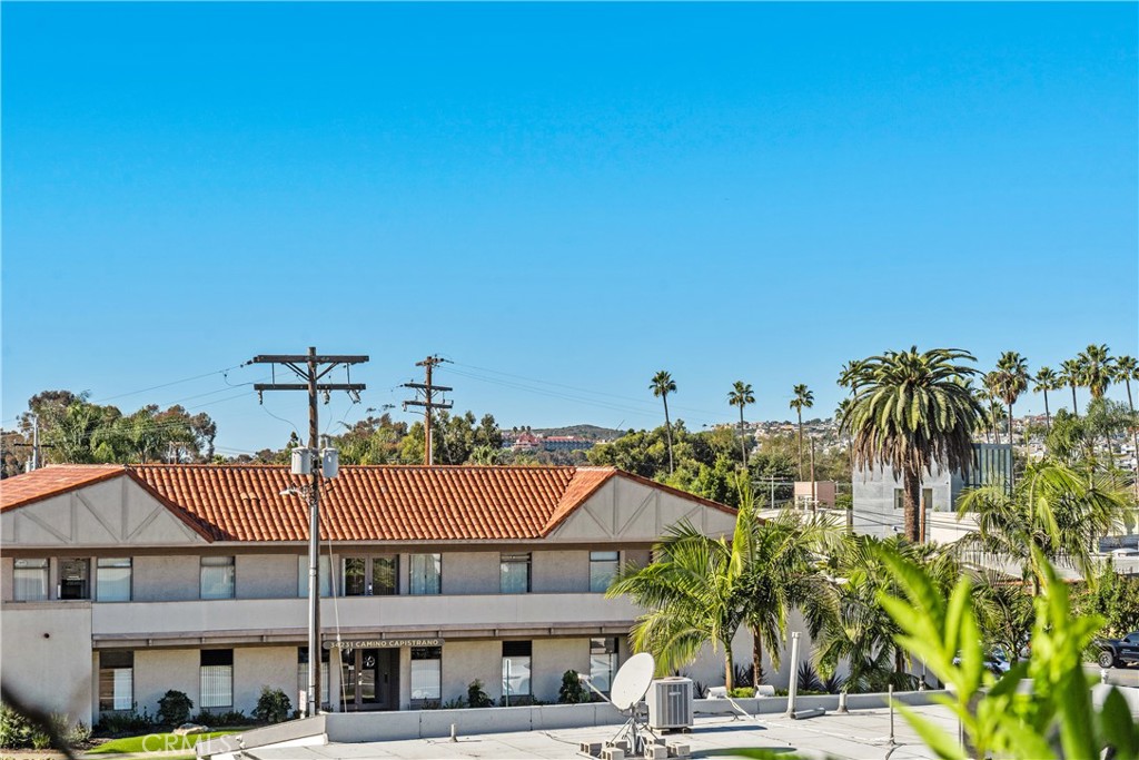 34264 Camino Capistrano, Unit 309 Dana Point, CA 92624 - Photo 23 of 35 a view of a house with a yard and potted plants