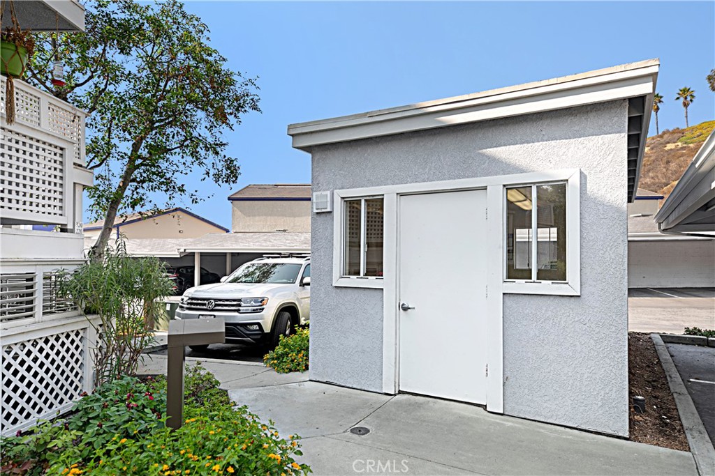 34264 Camino Capistrano, Unit 309 Dana Point, CA 92624 - Photo 30 of 35 a house view with a garden space