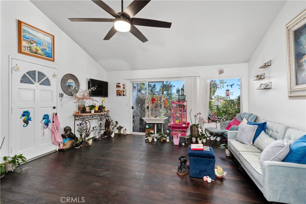 34264 Camino Capistrano, Unit 309 Dana Point, CA 92624 - Photo 10 of 35 a living room with furniture and a flat screen tv