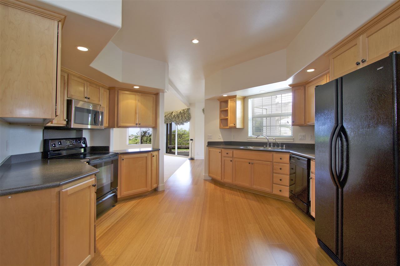 75 Kamalei Circle Kahului, HI 96732 - Photo 6 of 24 a kitchen with stainless steel appliances granite countertop a refrigerator a stove top oven a sink and dishwasher