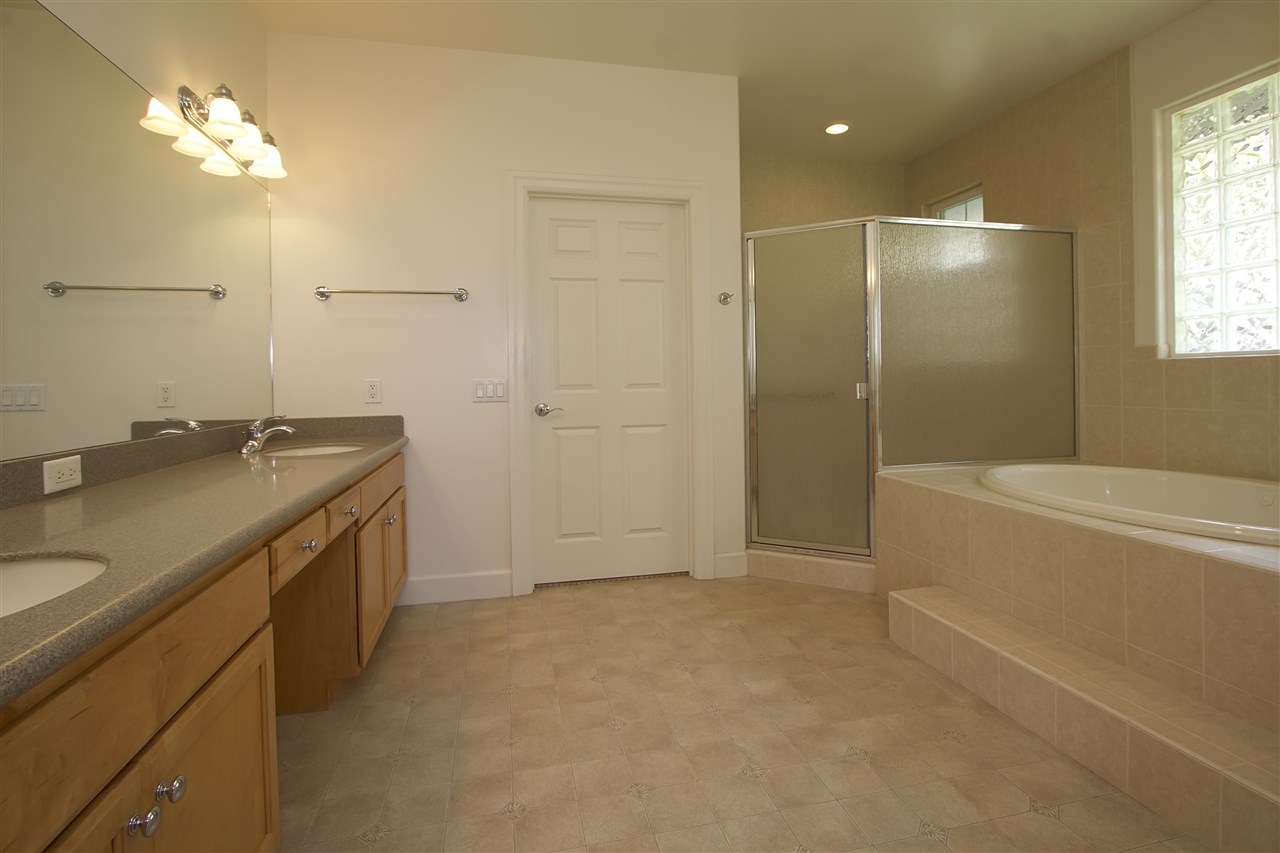 75 Kamalei Circle Kahului, HI 96732 - Photo 8 of 24 a bathroom with a granite countertop sink a toilet and shower