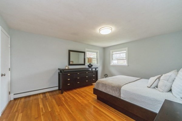 240 Worthen Road East Lexington, MA 02421 - Photo 11 of 33 a bedroom with a bed and a dresser