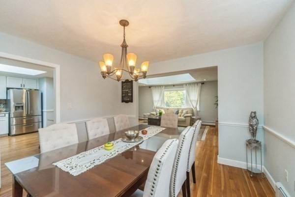 240 Worthen Road East Lexington, MA 02421 - Photo 6 of 33 a view of a dining room with furniture wooden floor and chandelier