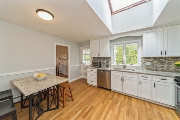 240 Worthen Road East Lexington, MA 02421 - Photo 8 of 33 a large kitchen with a table and chairs in it