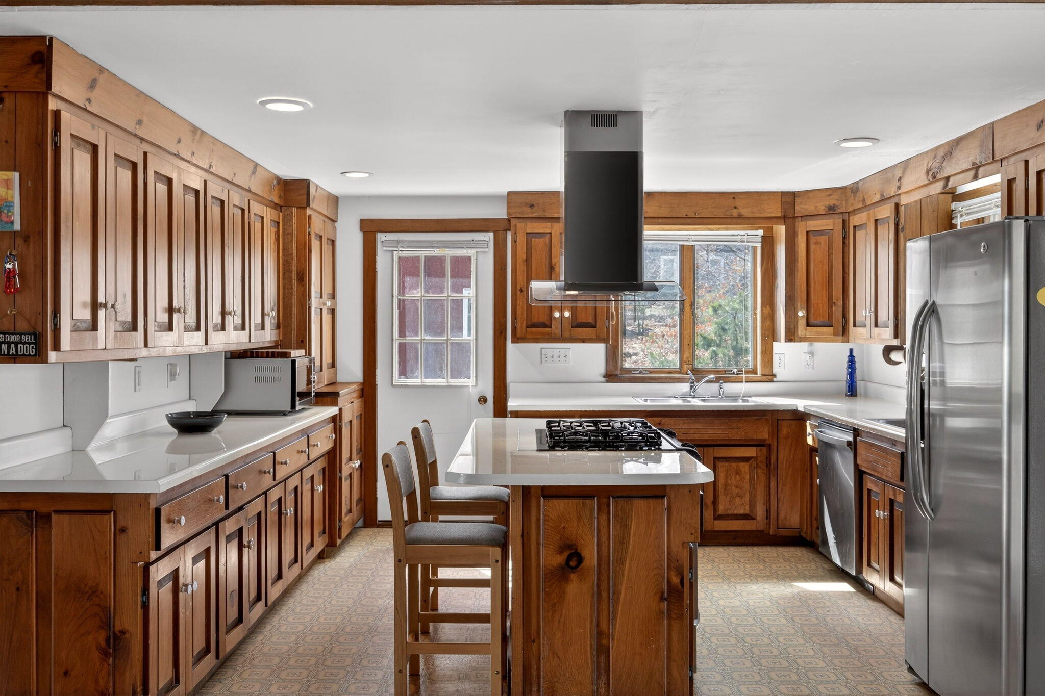 165 Cottontail Road Wellfleet, MA 02667 - Photo 8 of 46 a kitchen with stainless steel appliances granite countertop a stove a sink and a refrigerator