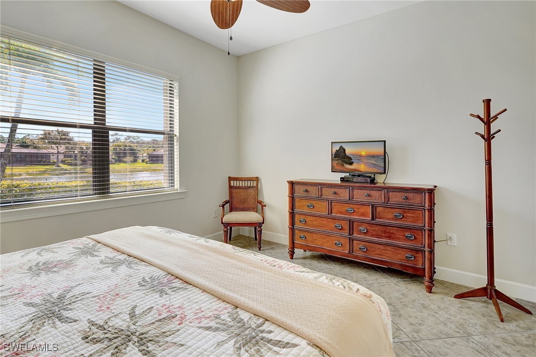 10879 Rutherford Road Fort Myers, FL 33913 - Photo 13 of 36 a bedroom with a bed and cabinets