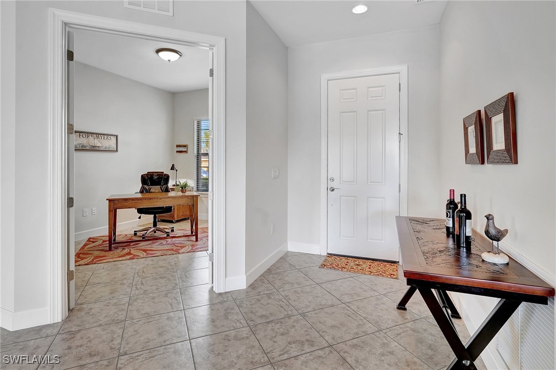 10879 Rutherford Road Fort Myers, FL 33913 - Photo 2 of 36 a living room with furniture and a window