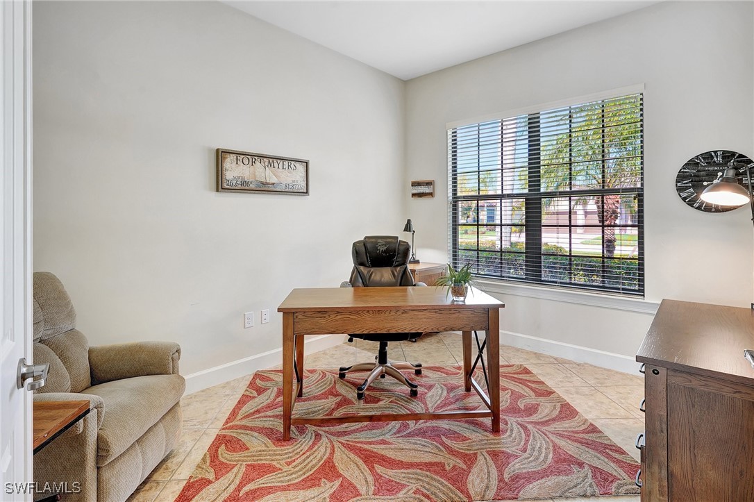 10879 Rutherford Road Fort Myers, FL 33913 - Photo 3 of 36 a living room with furniture and a window
