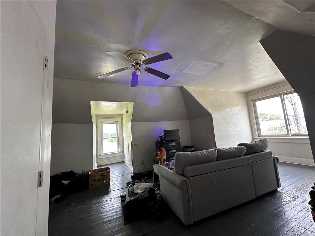 606 Chestnut Street New Castle, PA 16101 - Photo 12 of 12 a living room with furniture and a large window
