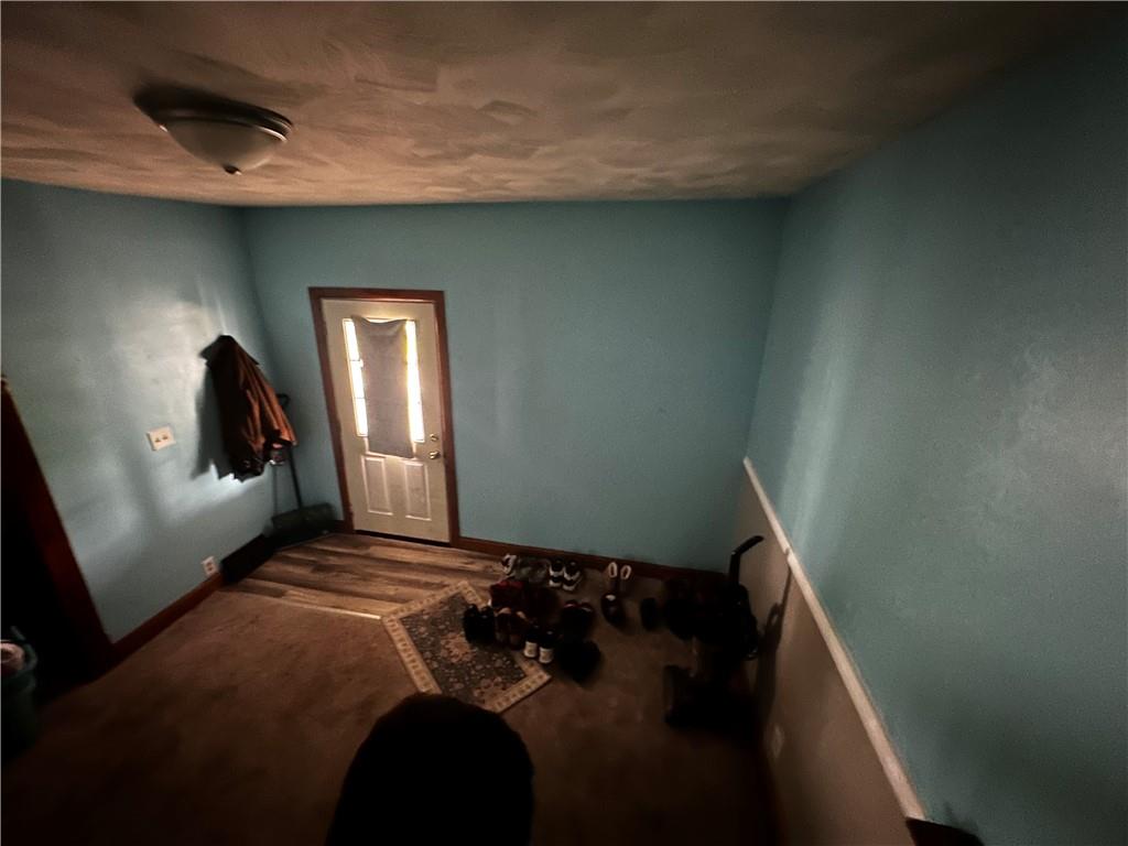 606 Chestnut Street New Castle, PA 16101 - Photo 2 of 12 a bedroom with a bed and window