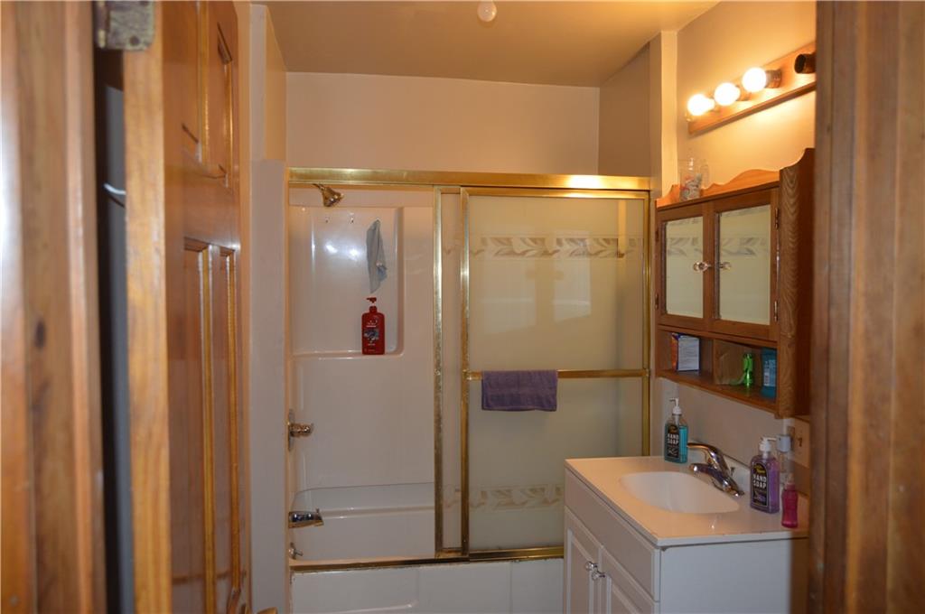 606 Chestnut Street New Castle, PA 16101 - Photo 6 of 12 a bathroom with a shower and a sink
