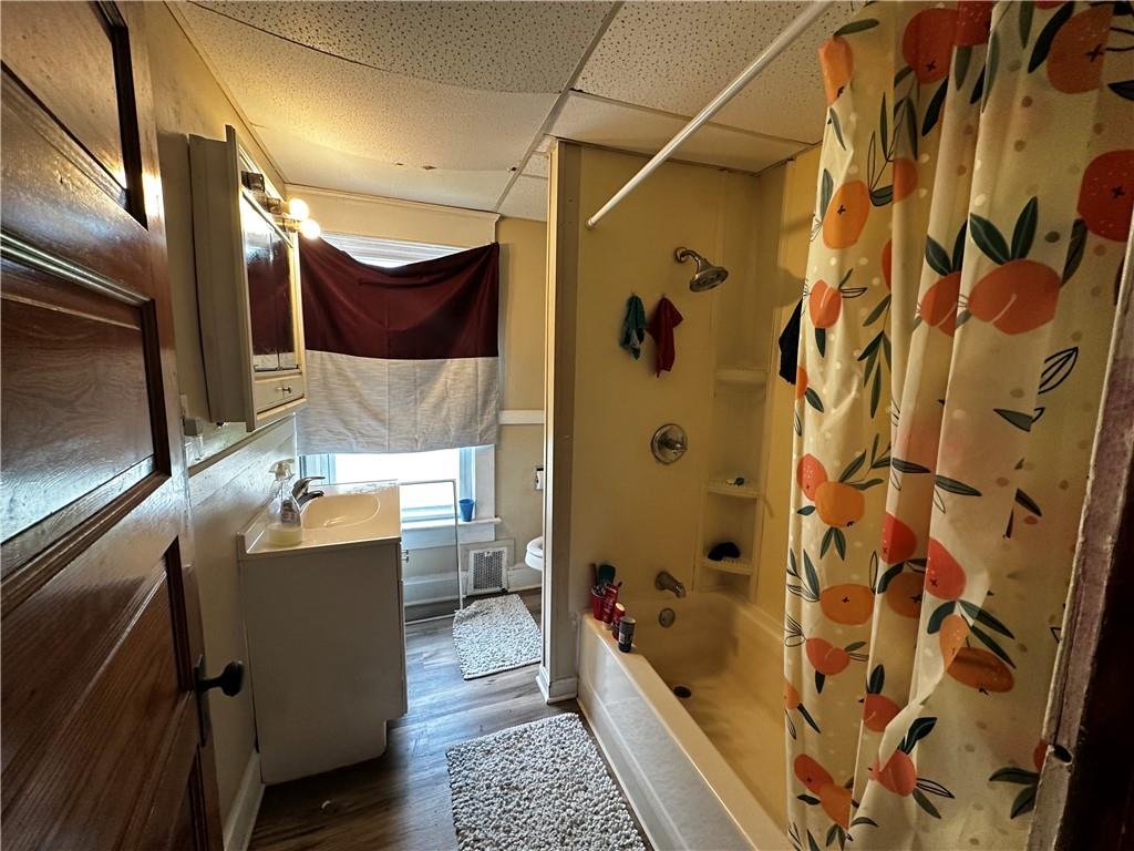 606 Chestnut Street New Castle, PA 16101 - Photo 7 of 12 a bathroom with a sink and mirror