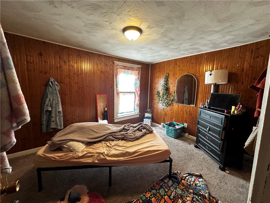 606 Chestnut Street New Castle, PA 16101 - Photo 9 of 12 a bedroom with bed and a window