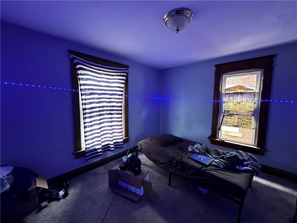 606 Chestnut Street New Castle, PA 16101 - Photo 10 of 12 a room with furniture and a window