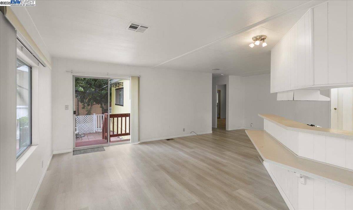 3263 Vineyard Avenue, Unit 44 Pleasanton, CA 94566 - Photo 12 of 31 a view of a room with an empty room and a window
