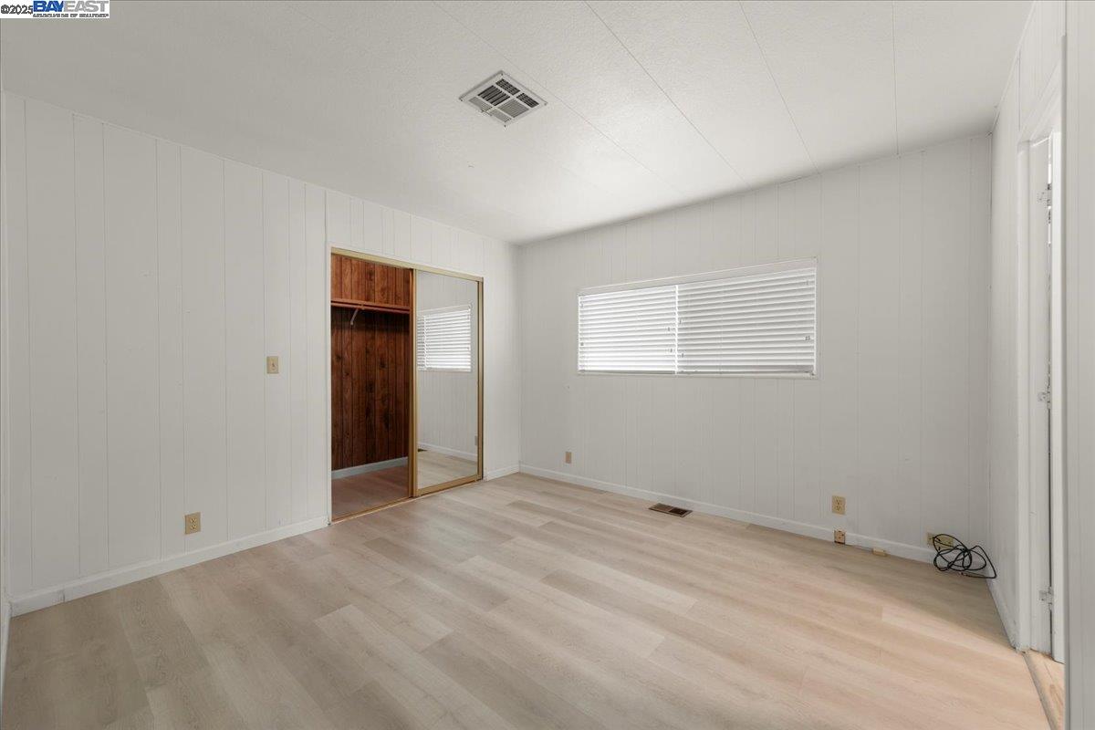 3263 Vineyard Avenue, Unit 44 Pleasanton, CA 94566 - Photo 26 of 31 a view of an empty room with closet and a window