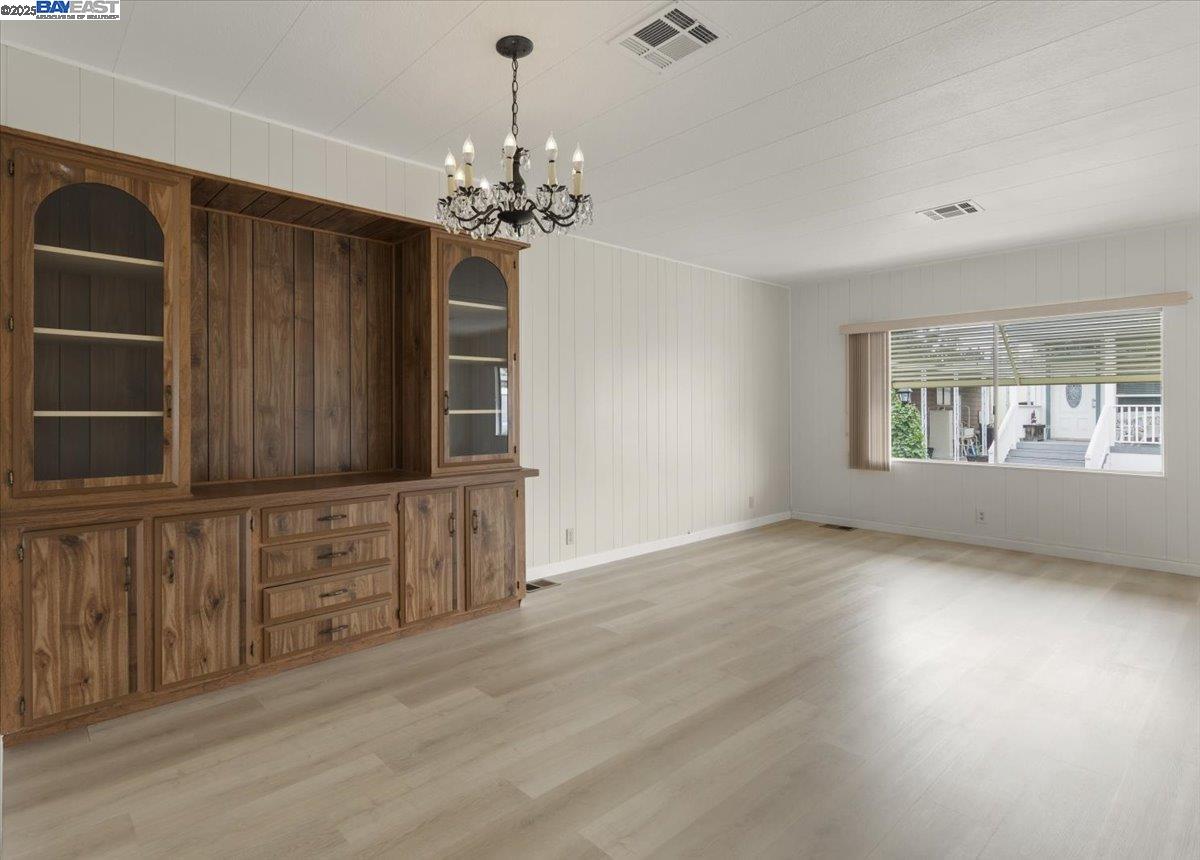 3263 Vineyard Avenue, Unit 44 Pleasanton, CA 94566 - Photo 9 of 31 wooden floor in an empty room with a window