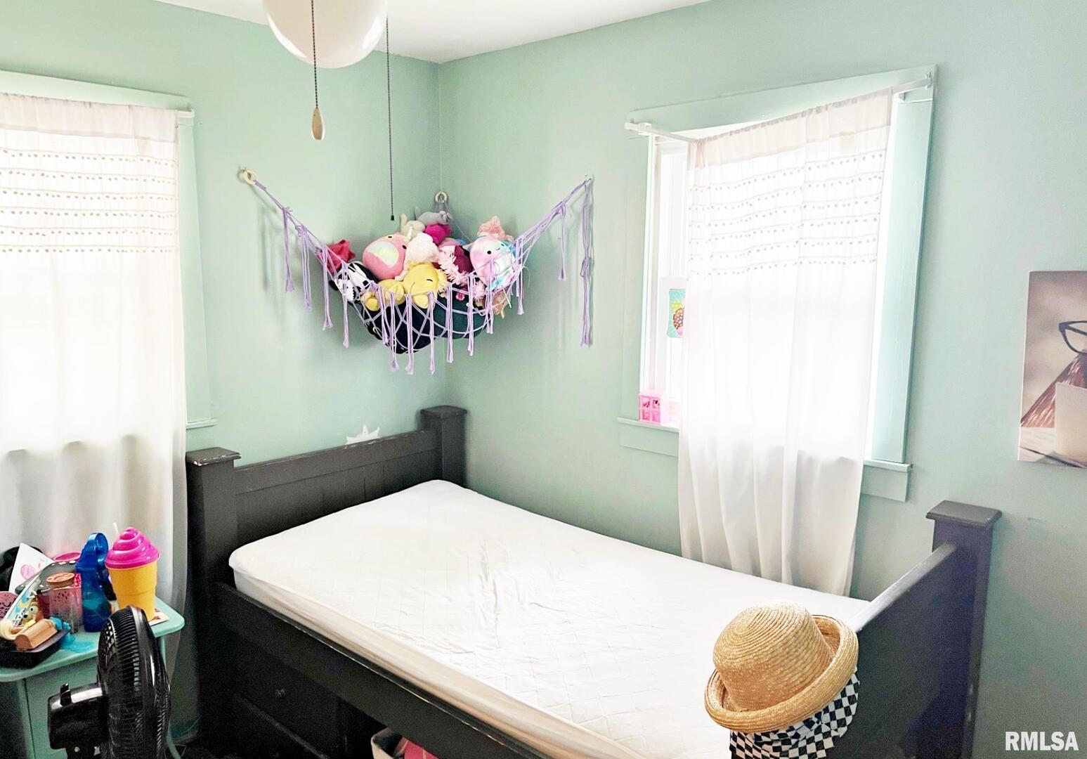 803 Butler Street Metropolis, IL 62960 - Photo 12 of 14 a bedroom with a bed and a table