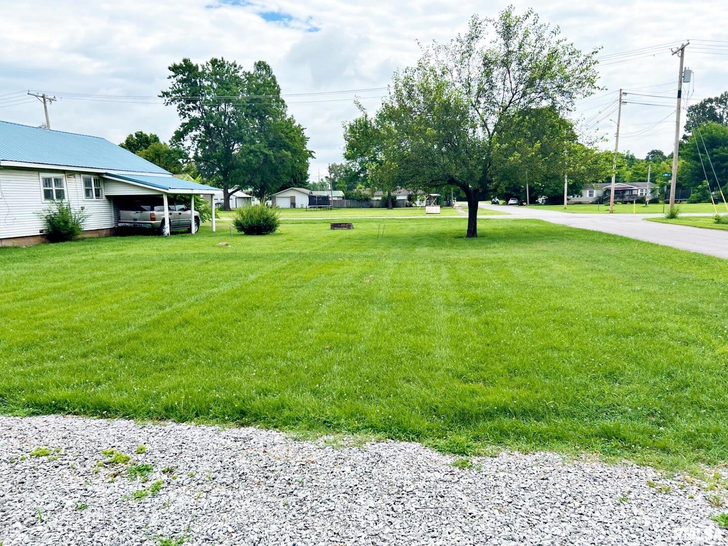 803 Butler Street Metropolis, IL 62960 - Photo 3 of 14 a front view of a house with a yard