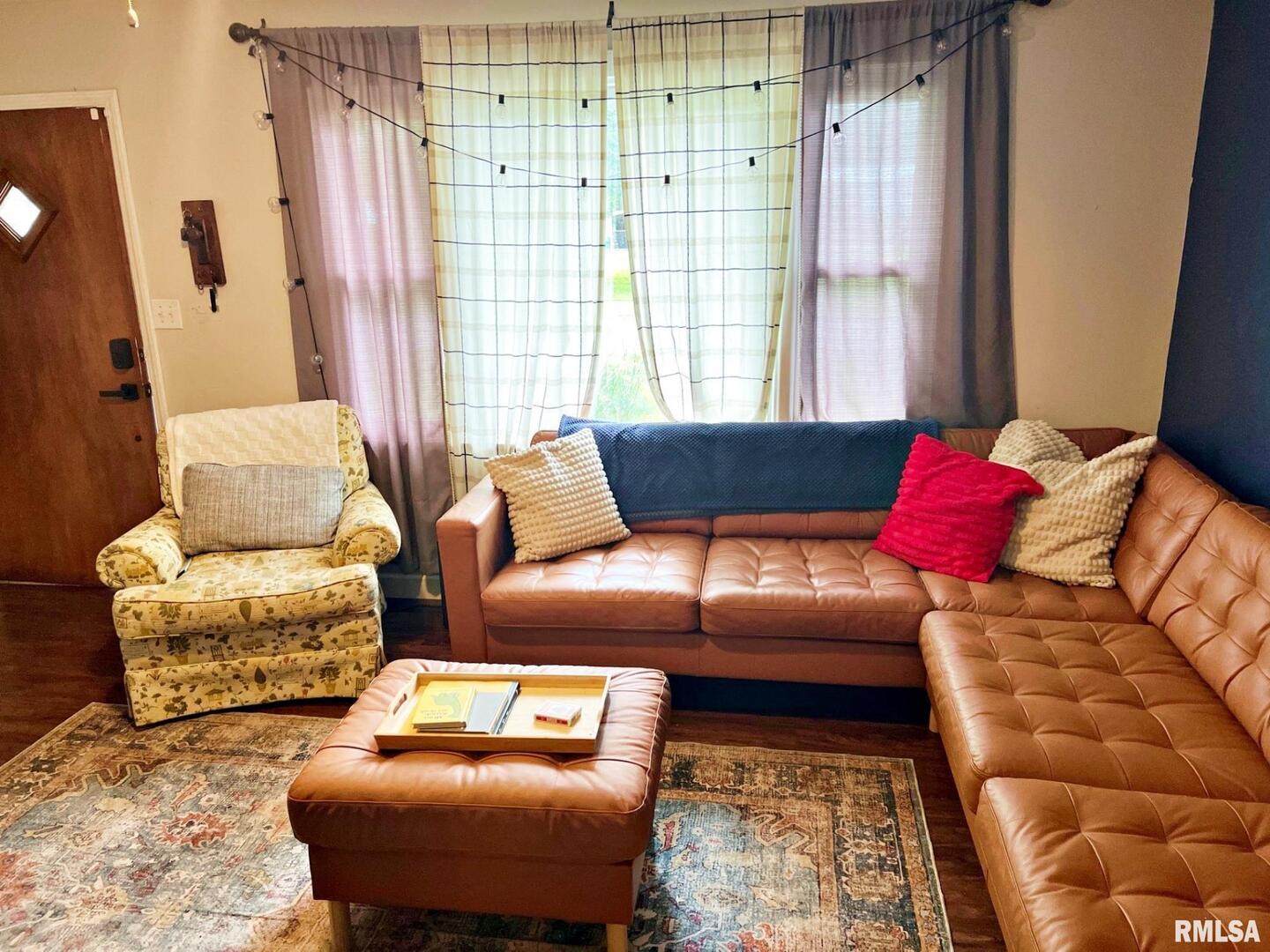 803 Butler Street Metropolis, IL 62960 - Photo 4 of 14 a living room with furniture and a large window