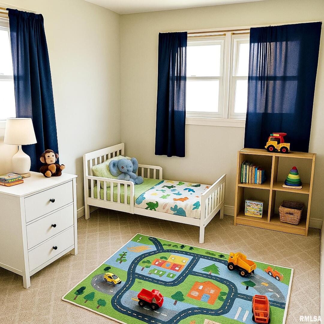 803 Butler Street Metropolis, IL 62960 - Photo 10 of 14 a bedroom with a bed and a dresser in it
