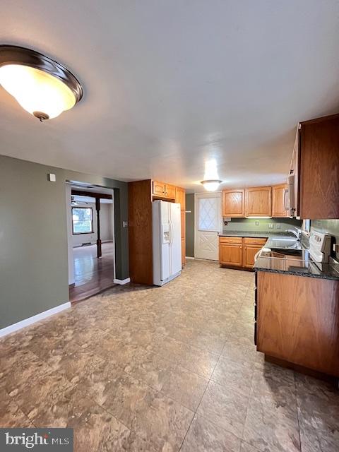 1857 Westside Lane Spring Grove, PA 17362 - Photo 11 of 35 a large kitchen with kitchen island granite countertop a refrigerator and a stove top oven