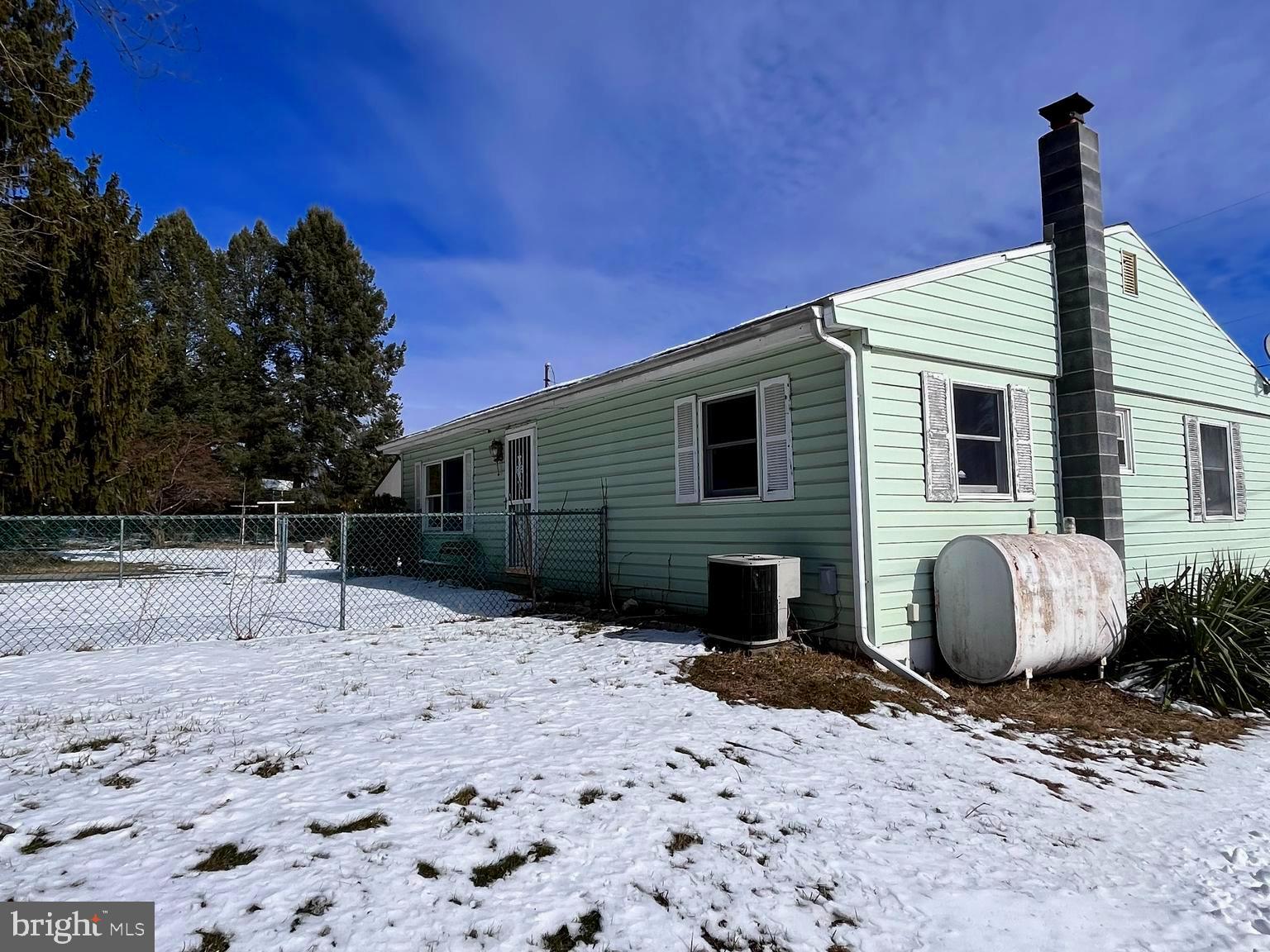 1857 Westside Lane Spring Grove, PA 17362 - Photo 5 of 35 a backyard of a house with potted plants and tree