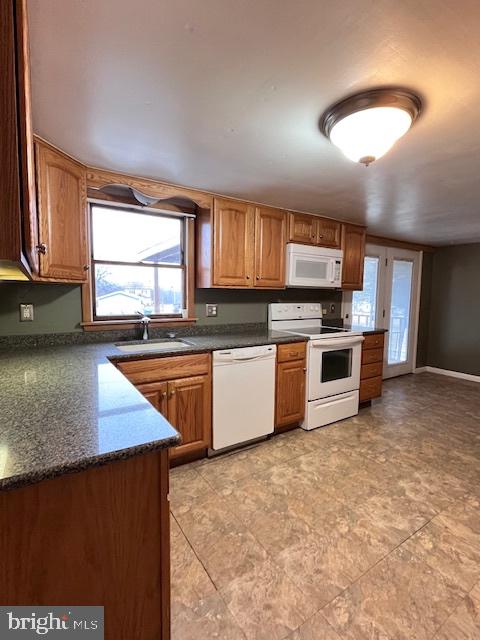 1857 Westside Lane Spring Grove, PA 17362 - Photo 7 of 35 a kitchen with stainless steel appliances granite countertop a stove a sink and a microwave