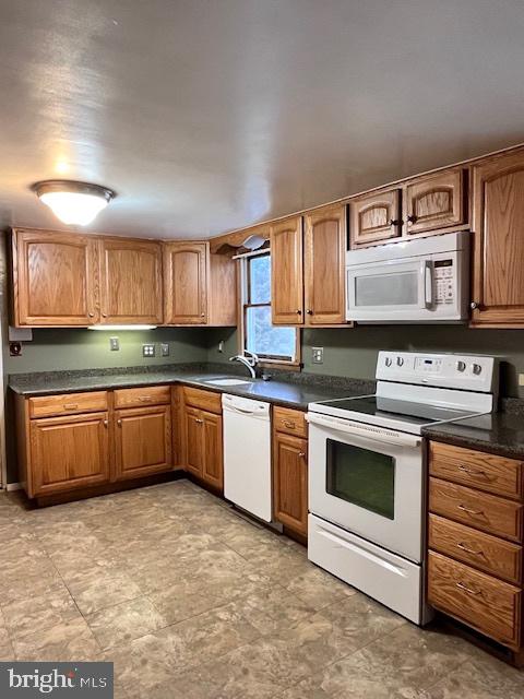 1857 Westside Lane Spring Grove, PA 17362 - Photo 9 of 35 a kitchen with stainless steel appliances granite countertop a stove a sink and a microwave