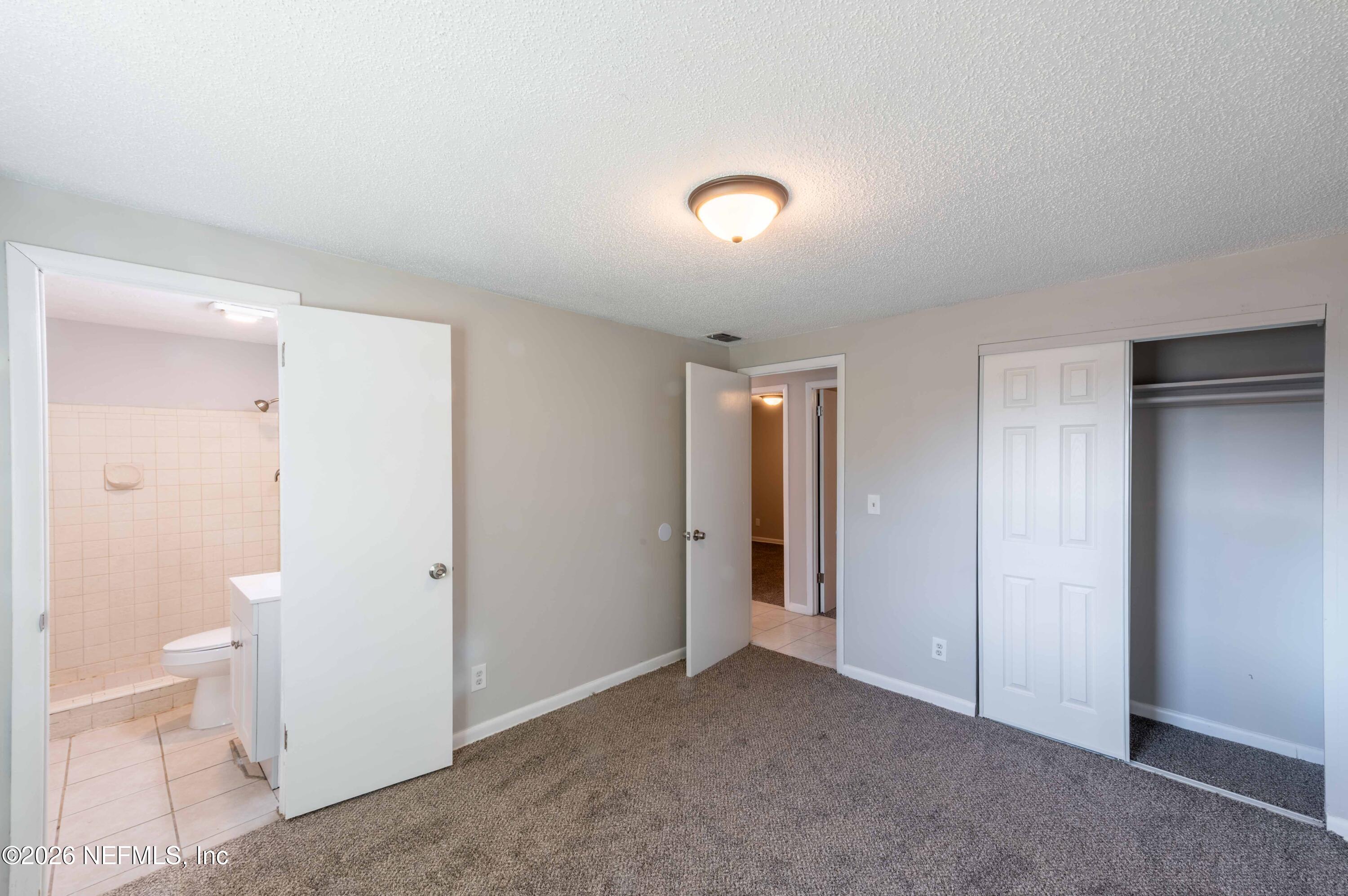 11605 Bayou Road Jacksonville, FL 32246 - Photo 4 of 39 a view of room with white walls and toilet