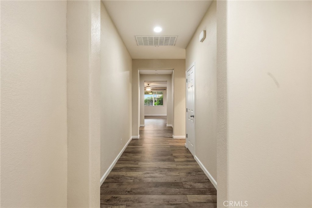 511 Glendon Court Merced, CA 95348 - Photo 12 of 37 a view of a hallway with wooden floor