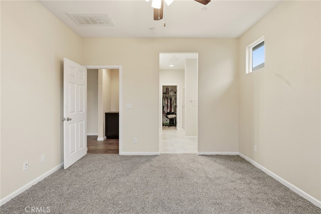 511 Glendon Court Merced, CA 95348 - Photo 14 of 37 an empty room with closet and windows