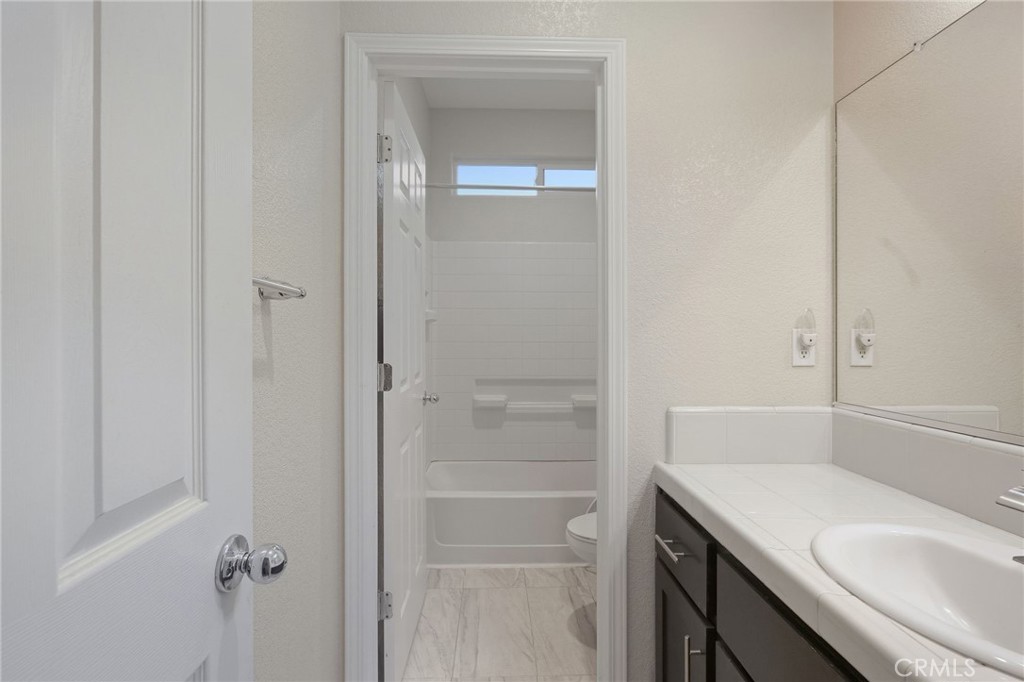 511 Glendon Court Merced, CA 95348 - Photo 22 of 37 a bathroom with a sink and vanity