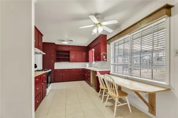 a kitchen with stainless steel appliances granite countertop a stove and a refrigerator