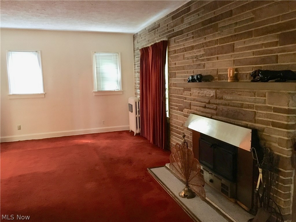 14200 Becket Road Cleveland, OH 44120 - Photo 3 of 10 LIVING ROOM AREA WITH FIREPLACE