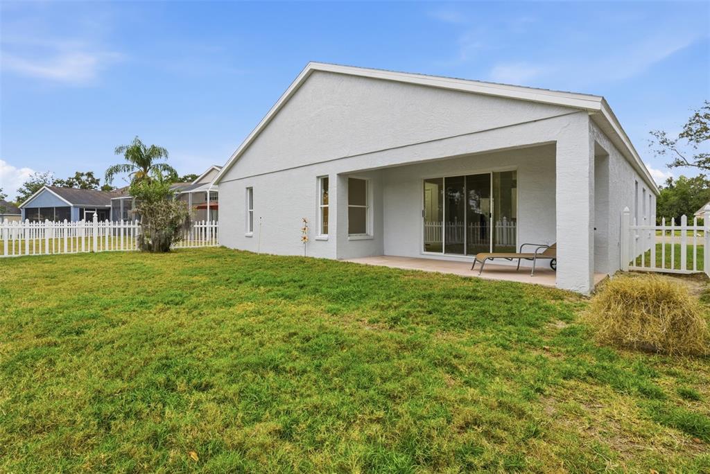 4534 Cabbage Key Terrace Bradenton, FL 34203 - Photo 27 of 33 a view of a house with backyard and porch