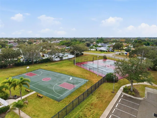 an aerial view of a pool patio swimming pool and lake view