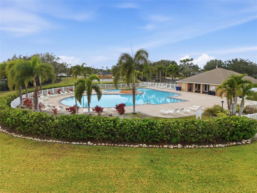 4534 Cabbage Key Terrace Bradenton, FL 34203 - Photo 31 of 33 a view of a swimming pool with an outdoor seating and yard