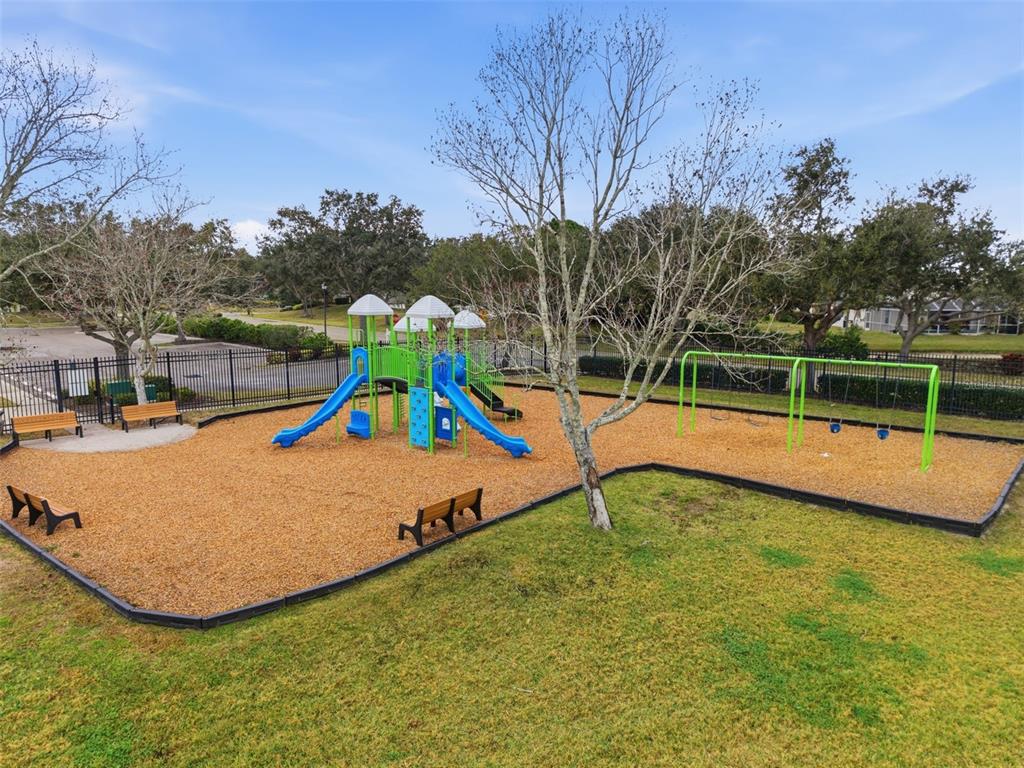 4534 Cabbage Key Terrace Bradenton, FL 34203 - Photo 32 of 33 a view of a park with swings and slides