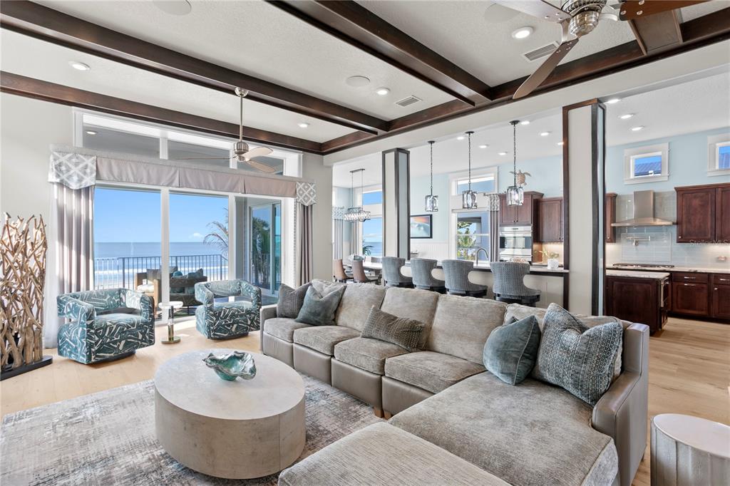 15612 Gulf Boulevard Redington Beach, FL 33708 - Photo 11 of 92 a living room with furniture kitchen view and a chandelier