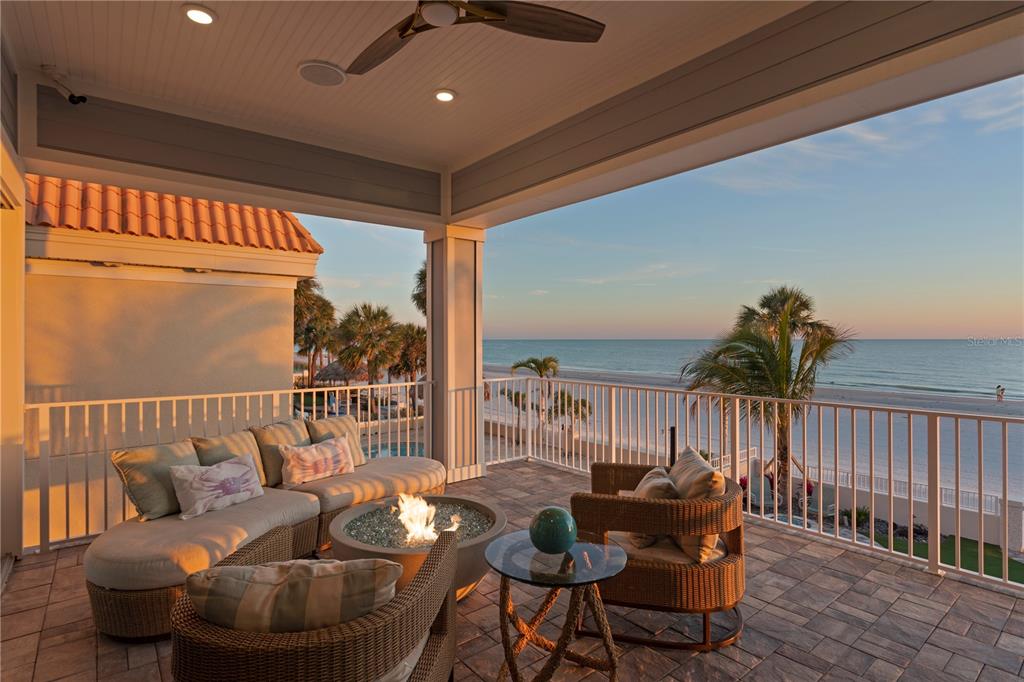 15612 Gulf Boulevard Redington Beach, FL 33708 - Photo 21 of 92 a balcony with furniture and wooden floor