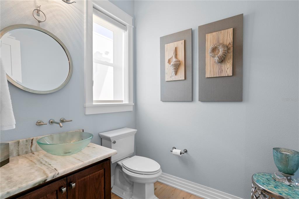 15612 Gulf Boulevard Redington Beach, FL 33708 - Photo 27 of 92 a bathroom with a granite countertop sink mirror and toilet