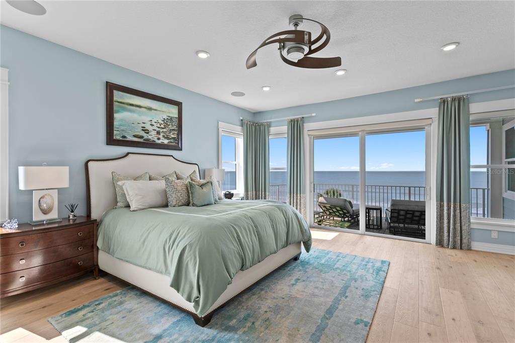 15612 Gulf Boulevard Redington Beach, FL 33708 - Photo 33 of 92 a spacious bedroom with a large bed and a large window